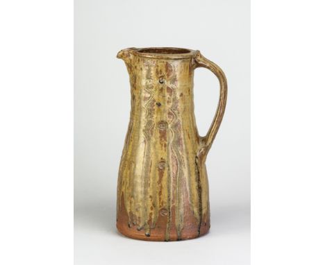 JIM MALONE (born 1946); a large stoneware pitcher covered in green ash glaze over kaki with impressed and incised decoration,