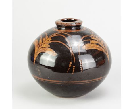 DAVID LEACH (1911-2005) for Lowerdown Pottery; a stoneware globular vase covered in tenmoku breaking to kaki glaze with wax r