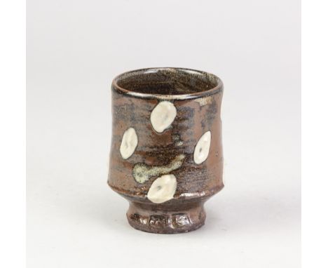 JIM MALONE (born 1946); a stoneware yunomi covered in kaki glaze with white decoration, impressed JM and L (for Lessonhall) m