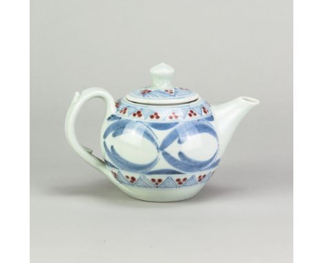 DEREK EMMS (1929-2004); a small porcelain teapot covered in celadon glaze with cobalt and copper red decoration, impressed DE