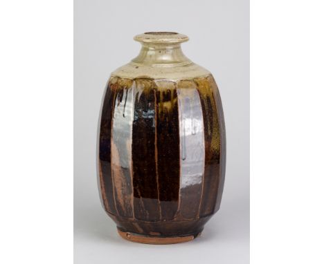 PHIL ROGERS (1951-2020); a large stoneware cut sided bottle covered in tenmoku breaking to kaki glaze with green ash top, imp