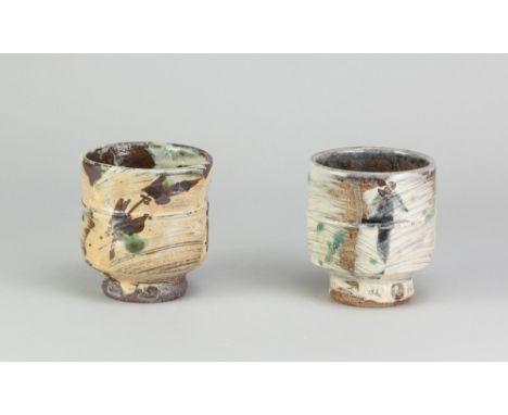 JIM MALONE (born 1946); two stoneware yunomi covered in brushed slip with iron, cobalt and copper green decoration, impressed