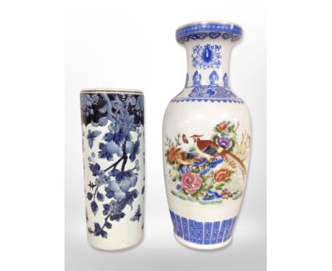 A 20th-century oriental porcelain baluster vase, height 62cm, together with a blue and white stick stand.