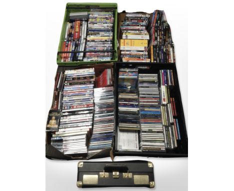 A large quantity of CDs and DVDs, and a Goodmans portable record player, in case. (4 boxes)