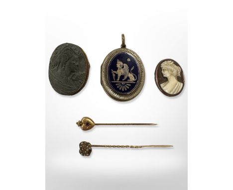 Two Victorian gold stick pins, one set with a ruby, the other seed pearls, together with a 19th century enamelled memorial lo