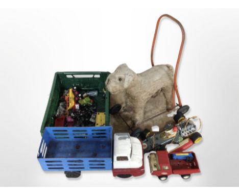 A child's vintage push-along mohair dog, together with other toys, including diecast Tonka truck, etc. (1 box)