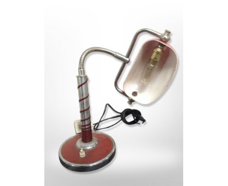 A 20th-century chrome and enamelled adjustable desk lamp, height 40cm.