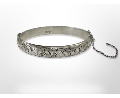 An engraved silver bangle, inner diameter 6cm CONDITION REPORT: 14.7g