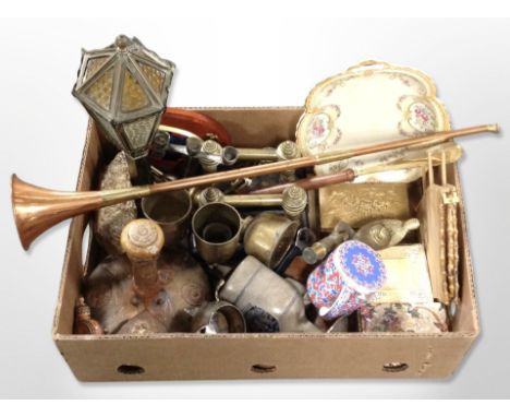 A group of metal wares including pair of brass fire dogs, copper horn, antique brass microscope, lamp in the form of a street