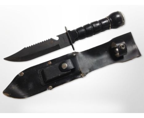 A dagger in sheath with blade stamped 'Taiwan'.