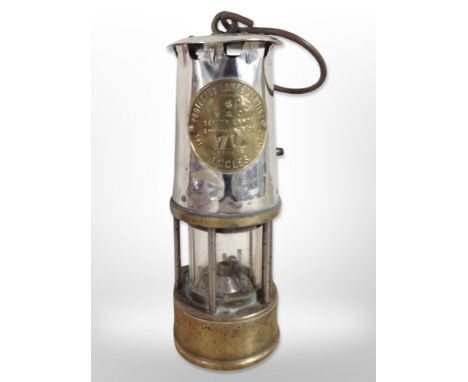 A chrome Eccles Type 6RS miner's safety lamp.