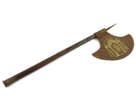 An iron and hardwood axe, decorated to the iron blade with figures within a tent etc., and stylised Arabic type writing, the 