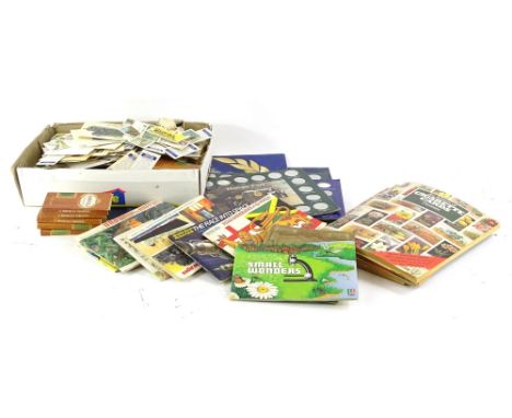 A large quantity of cigarette cards, books of cigarette cards, trade cards, tea cards, shelf collectives medallions etc.