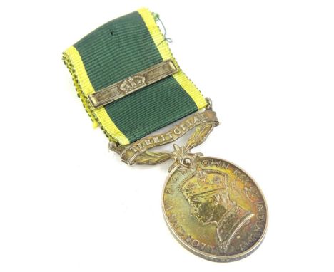 A George V Territorial Army Efficiency Service medal with bar, awarded to a 3949353 Corporal A.E Jones, Royal Engineers.