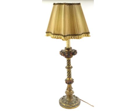 A Venetian type gilt and polychrome decorated table lamp, with bands of fruit, leaves, etc. and a shade, 52cm high.