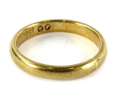 A 9ct gold wedding band, of plain design, bearing makers stamp JH, Chester assay, ring size K½, 2.3g all in.