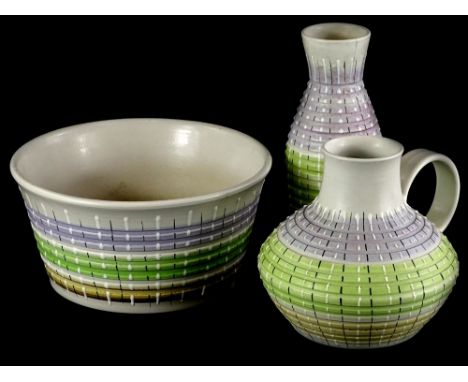 Three items of Bourne Denby stoneware, each decorated with bands of green, purple and brown and highlighted with black and wh