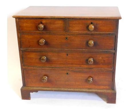 An early 19thC mahogany chest, of two short and three long graduated drawers, with knob handles and bracket feet.
