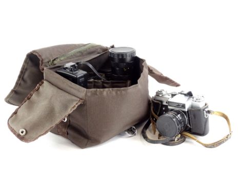 A Zenit-E camera and various lenses.