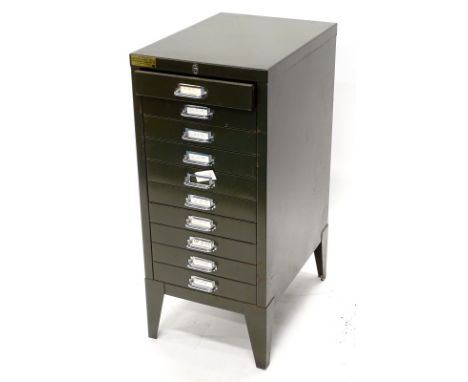 A set of green painted metal filing drawers, on bracket feet, 32cm wide.