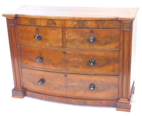 A Victorian mahogany bow fronted chest of drawers, with two short and two long drawers, each with ebonised and mother of pear