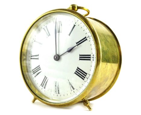 A late 19th/early 20thC French brass travelling clock, with a circular case, the white enamel dial with Roman numerals, unmar