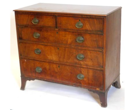 An early 19thC mahogany chest of drawers, the top with a moulded edge above two short and three long drawers, each with brass