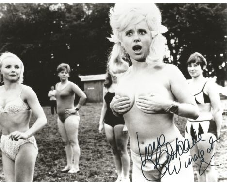 Dame Barbara Windsor signed 10x8 black and white photograph pictured during her time playing in the Carry On films. Good cond