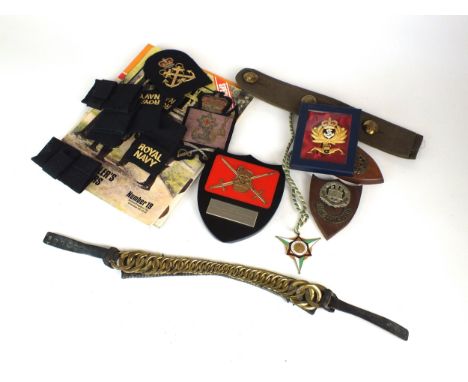 A collection of assorted militaria comprising an Airborne Forces Golden Jubilee glass paperweight, R.A.F steel seal, horn-han