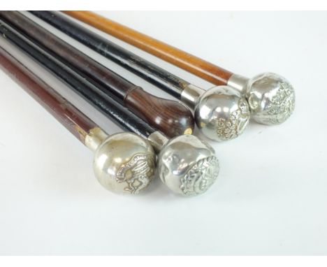 Three British Regimental swagger sticks with white metal bulbous tops, comprising Durham Light Infantry, London Irish Rifles,