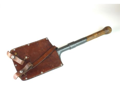A Swiss WWII entrenching tool with brown leather cover, marked 'Fr. Bangerter Burgen' and dated 1940