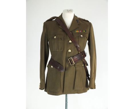 An early 1950s Royal Engineers jacket with collar badges, retailed by Hawkes &amp; Co Ltd Saville Row, with WW2 medal ribbons