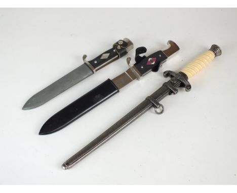 A post-war reproduction "de-Nazified" Hitler Youth knife and scabbard, blade stamped Carl Schlieper Solingen Germany, overall