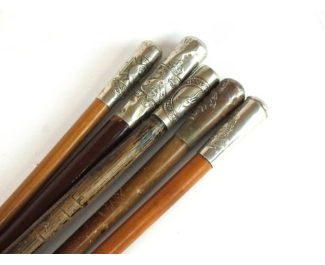 Four British Regimental swagger sticks with white metal tops comprising Northumberland Fusiliers, Royal Marines, South Africa