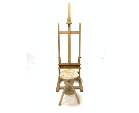 Pine artists adjustable easel, (H172cm, W56cm) together with a pine circular rise and fall stool, (D30cm) - Condition Report 