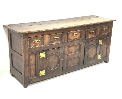 Georgian oak dresser, with two long and one short drawer over two fielded panelled cupboards enclosing a shelf, raised on sti