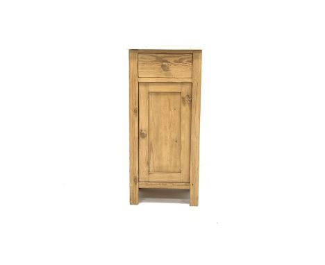 Stripped pine bedside cupboard, with marble top over one drawer and panelled cupboard enclosing a shelf, raised on stile supp