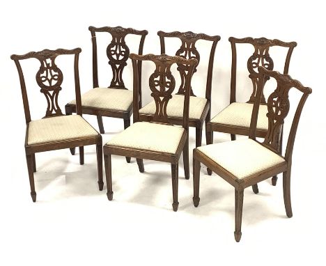 Set six early 20th century oak Chippendale style dining chairs, shaped cresting rail carved with scroll leafage, pierced and 