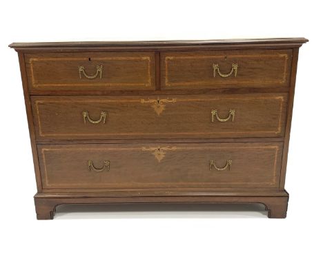 Early 20th century mahogany chest fitted with two short and two long drawers, with satinwood banding and boxwood floral inlay