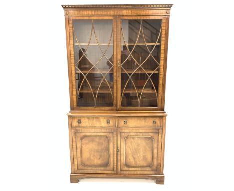 Georgian style mahogany bookcase cabinet, dentil cornice over astragal glazed doors enclosing three adjustable shelves, two d