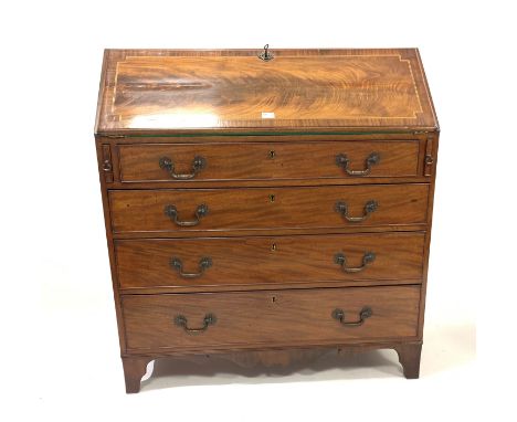 Georgian mahogany bureau, cross banded and string inlaid sloped front falling to reveal well fitted interior, with drawers, c