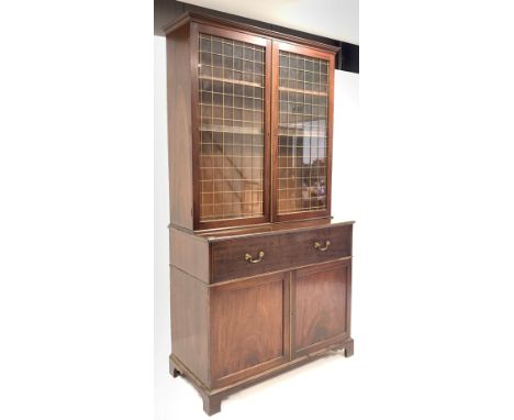 George III mahogany secretaire bookcase, glazed doors with brass grill enclosing three adjustable shelves, fall front drawer 