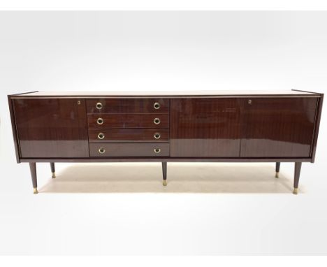 Mid Century retro Italian mahogany veneered Vintage sideboard, circa 1970s, fitted with four drawers flanked by two cupboards