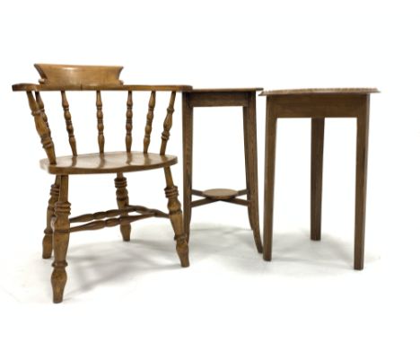 Elm and beech smokers bow armchair, with spindle back over saddle seat, raised on ring turned supports united by double 'H' s