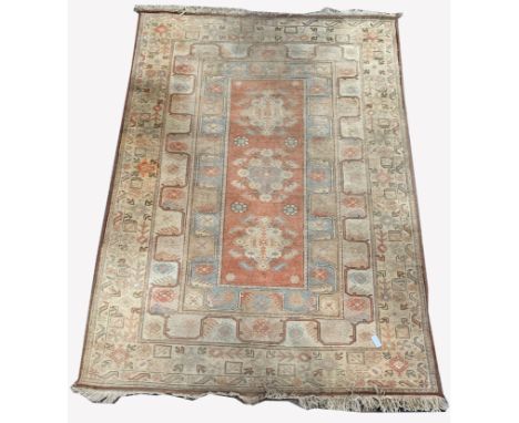 Vintage Turkish ground rug, three medallions on orange field, enclosed by geometric designs to multi line border, 302cm x 211