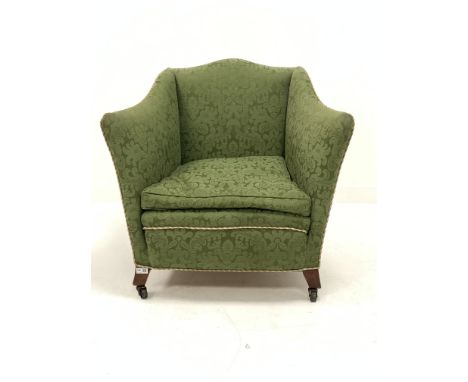Edwardian easy armchair of square form, upholstered in green Damask, with squab cushion, raised on square tapered and splayed