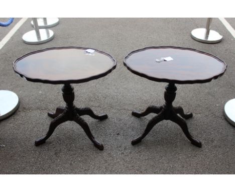 A pair of reproduction mahogany tripod tables, together with a small cake stand (3)