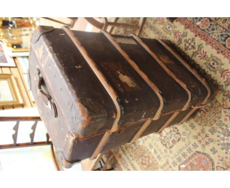 An early 20th Century canvas and leather bound travelling trunk, bearing initials 'H.E.C'