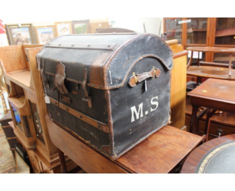An early 20th Century wood bound leather travelling trunk, arch topped