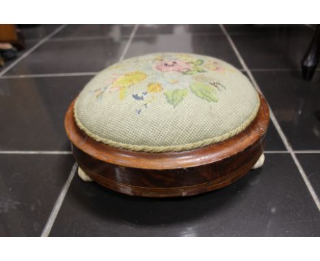 A 19th Century mahogany footstool, inlaid decoration, ceramic feet